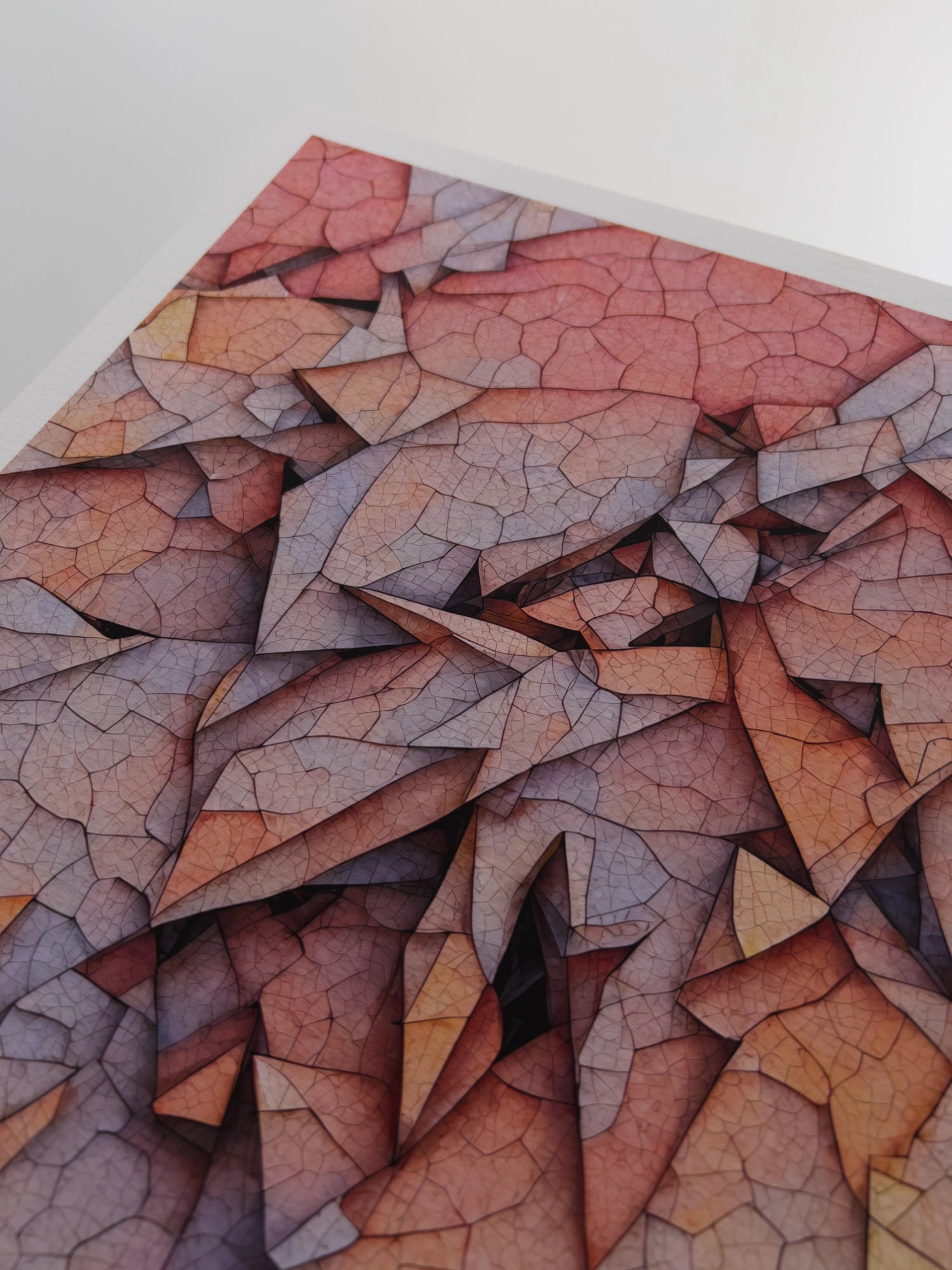 A close up artwork detail of a pastel, peach and plum couloured, geometric abstraction reminiscent of layers of leaves with venation patterns.