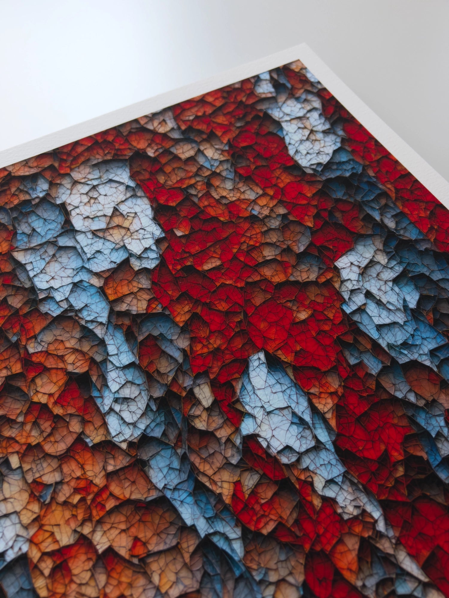 A close up artwork detail of red and blue stalactite-like, three-dimensional structures connected by a network of veins.